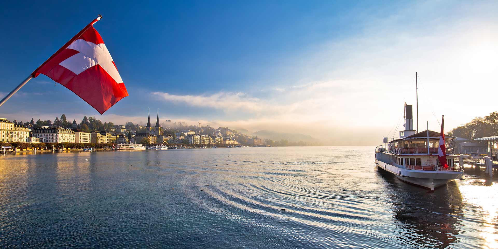 lucern lake and town waterfront in morning mystic fog view, famous destination in switzerland
