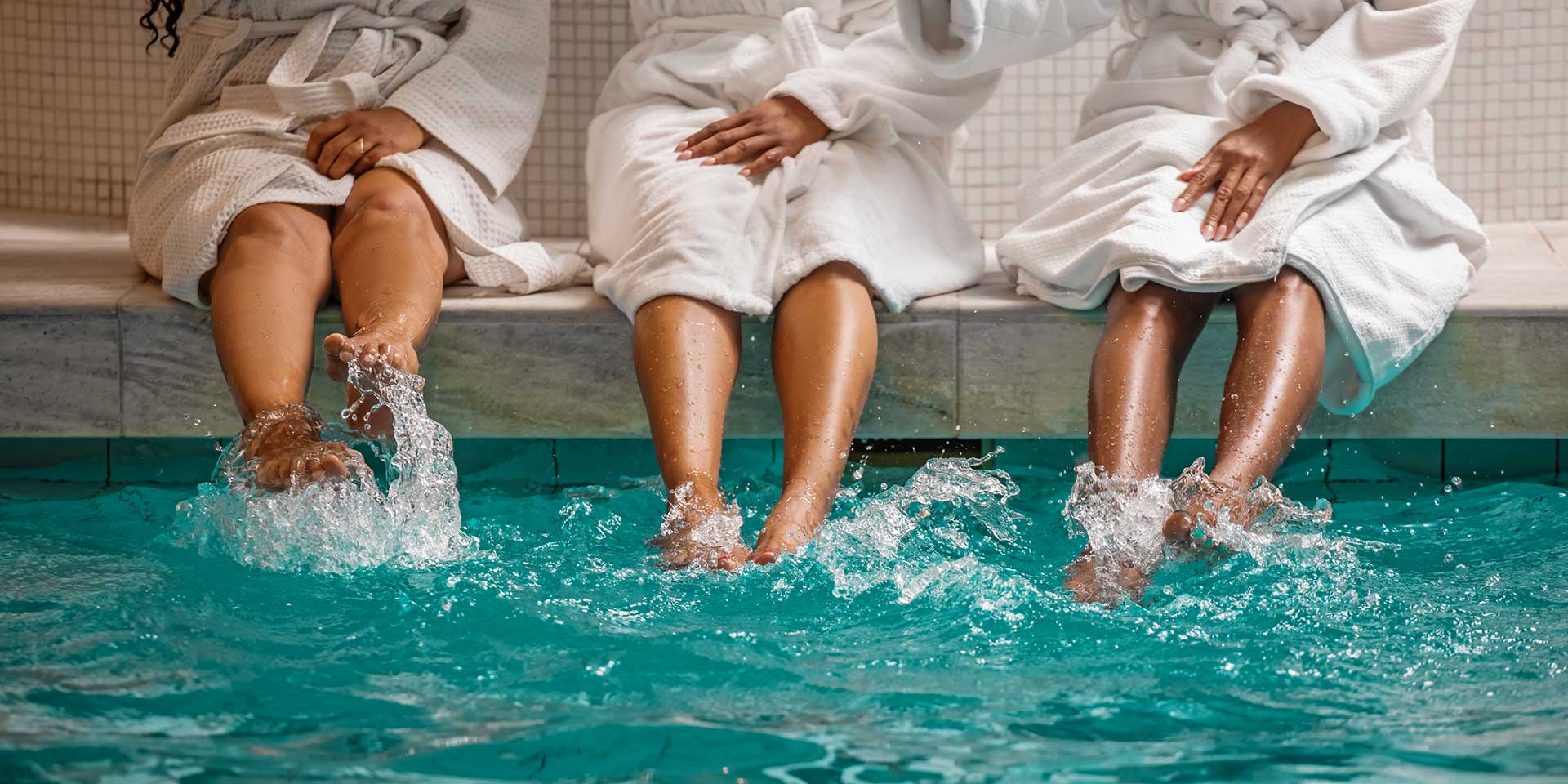 three beautiful senior black men enjoying a relaxing time in a health spa