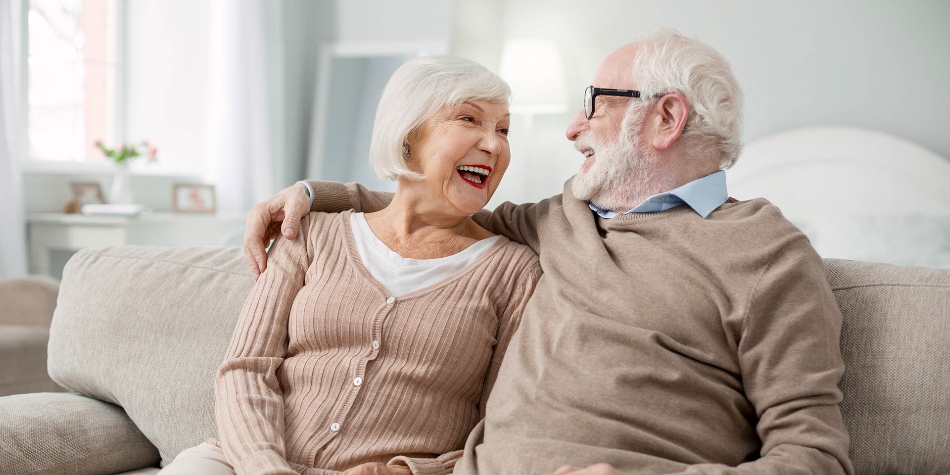 happy together. joyful elly couple smiling to each other while being in a great mood
