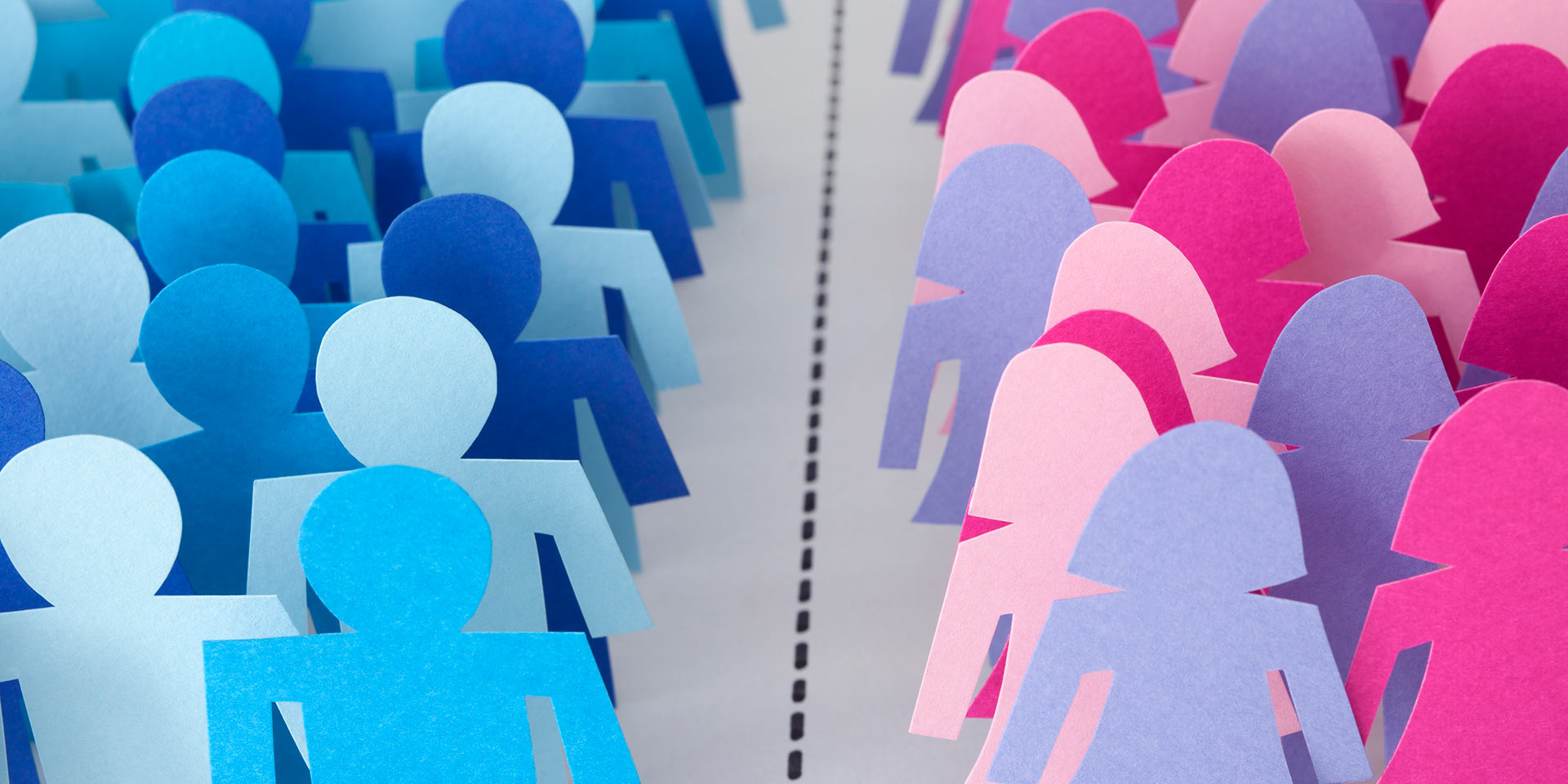 conceptual image of paper men and men silhouettes divided by dotted line